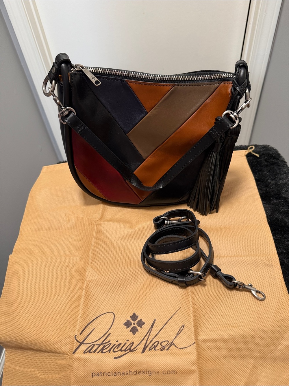Patricia Nash Black Patchwork Crossbody with Brown, Tan & Red Accents